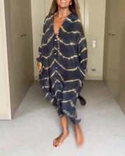 MAGGIE | Vid skuren maxiklänning med V-ringning