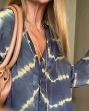 MAGGIE | Vid skuren maxiklänning med V-ringning