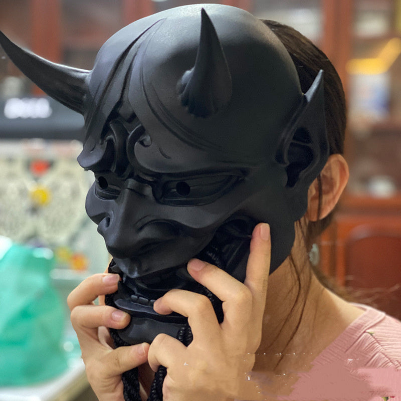 Japanische Dose, rotgesichtige Grimasse mit Seilhörnern 1