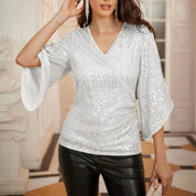 Nadine | Glittrande V-ringad blus med utsvängda ärmar