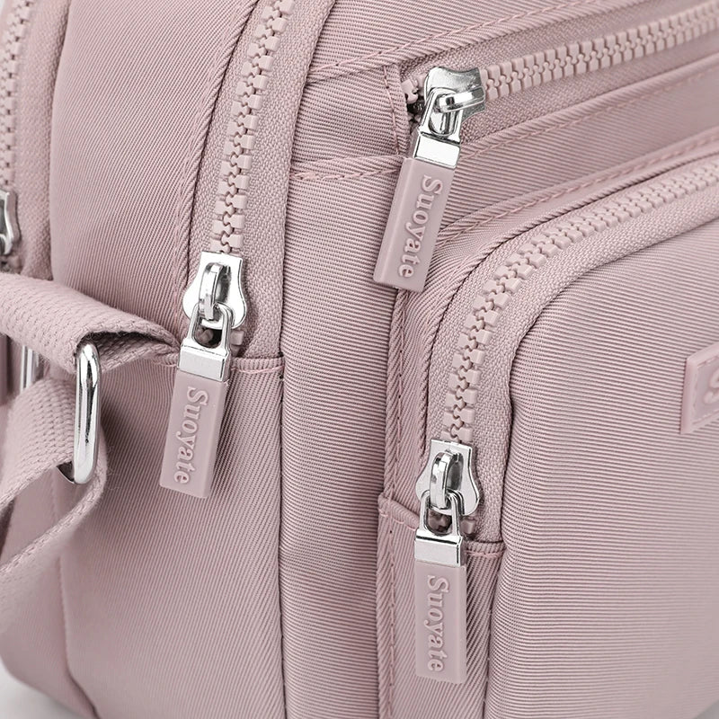 Zoe | Kompakt nylon crossbody-slingväska