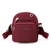 Zoe | Kompakt nylon crossbody-slingväska
