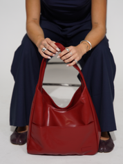 Elegante runde Schultertasche für Damen aus veganem Leder 1